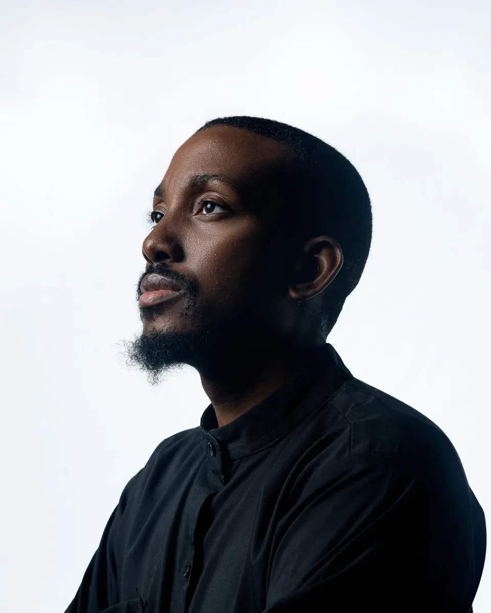 Adeilé, studio portrait in a black shirt